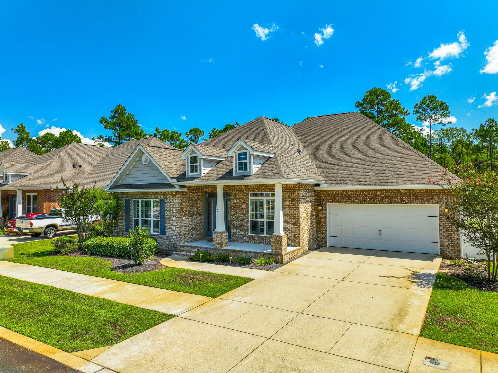 29 Buddy Lane Santa Rosa Beach, FL 32459 - Photo 2 of 47 a front view of a house with a yard