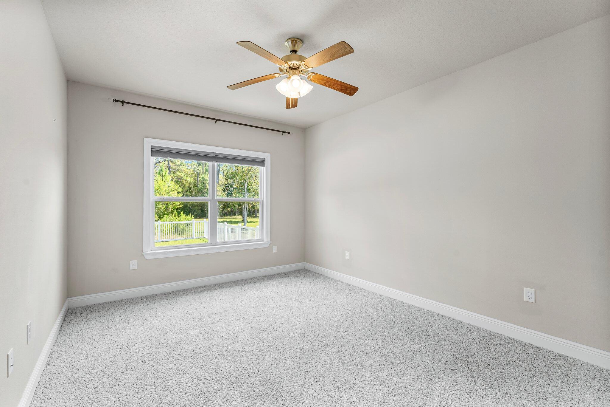 29 Buddy Lane Santa Rosa Beach, FL 32459 - Photo 29 of 47 an empty room with ceiling fan and window