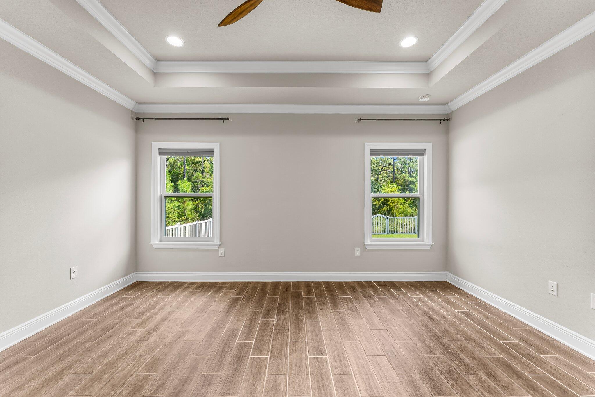 29 Buddy Lane Santa Rosa Beach, FL 32459 - Photo 32 of 47 an empty room with wooden floor and windows