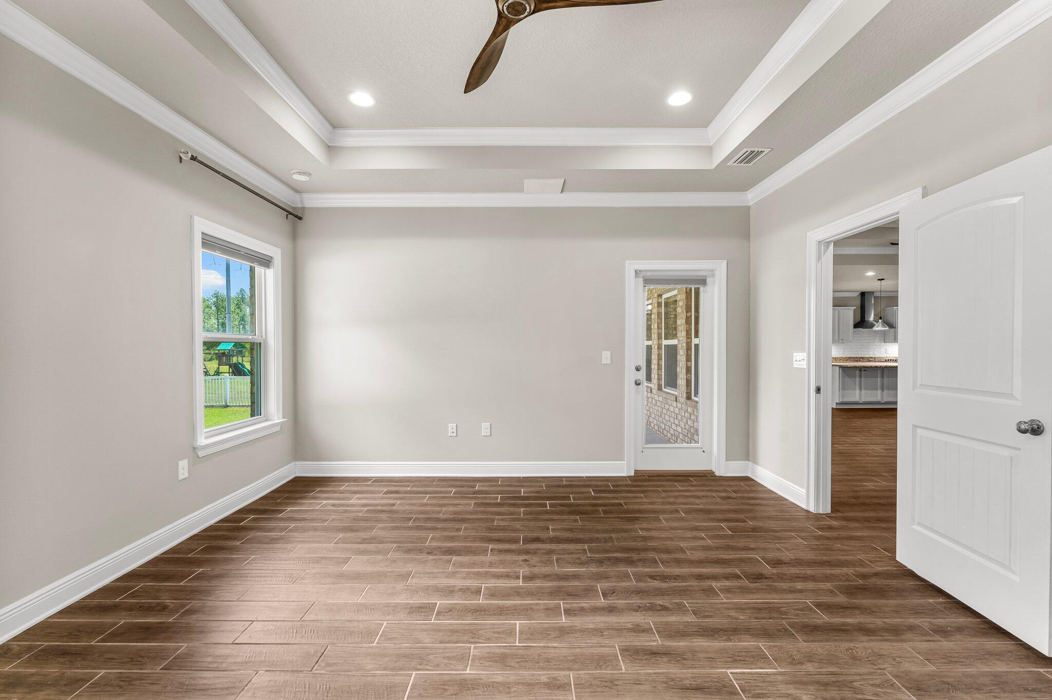 29 Buddy Lane Santa Rosa Beach, FL 32459 - Photo 33 of 47 wooden floor in an empty room with a window