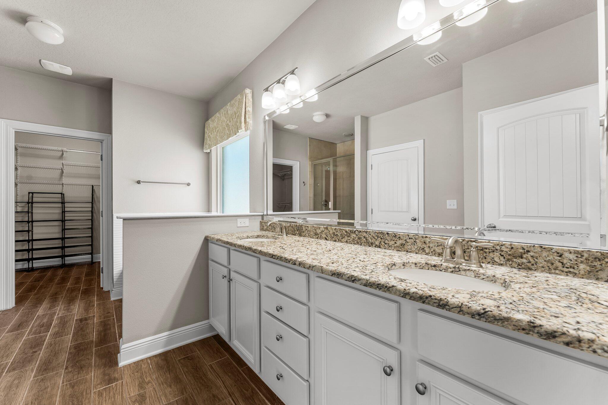 29 Buddy Lane Santa Rosa Beach, FL 32459 - Photo 35 of 47 a bathroom with a granite countertop double vanity sink and mirror