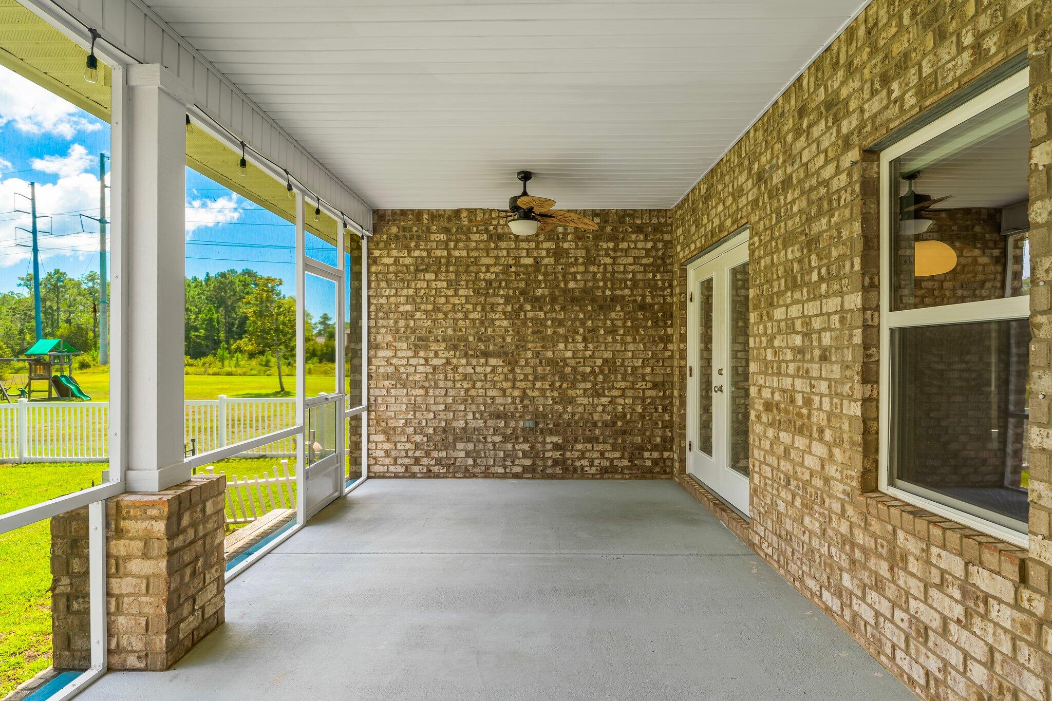 29 Buddy Lane Santa Rosa Beach, FL 32459 - Photo 41 of 47 wooden floor in an empty room with a window