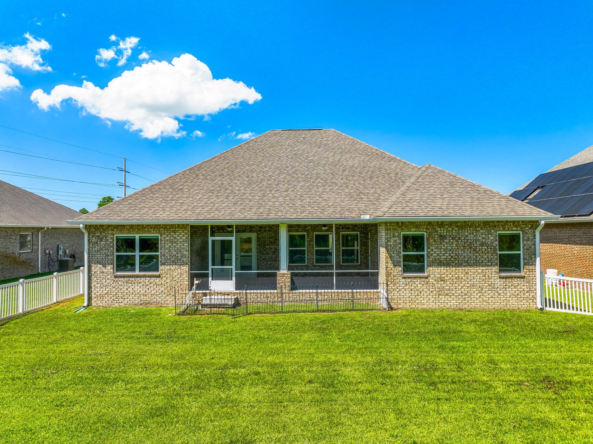 29 Buddy Lane Santa Rosa Beach, FL 32459 - Photo 47 of 47 a backyard of a house with table and chairs