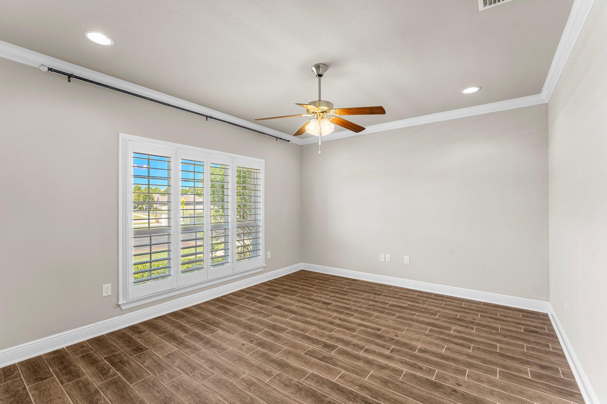 29 Buddy Lane Santa Rosa Beach, FL 32459 - Photo 9 of 47 a view of an empty room with a window and wooden floor
