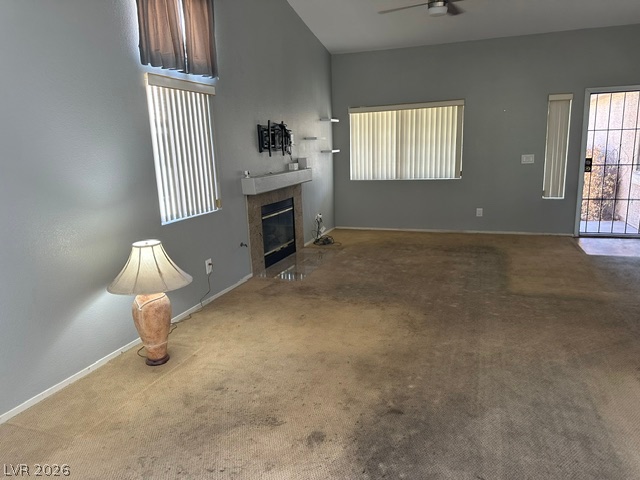 686 Skyline Road Henderson, NV 89002 - Photo 4 of 13 High vaulted ceilings and a classic fireplace anchor this open living area.