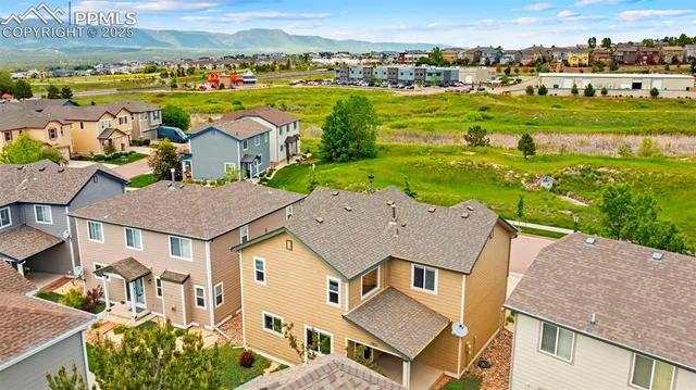 an aerial view of a house with a garden