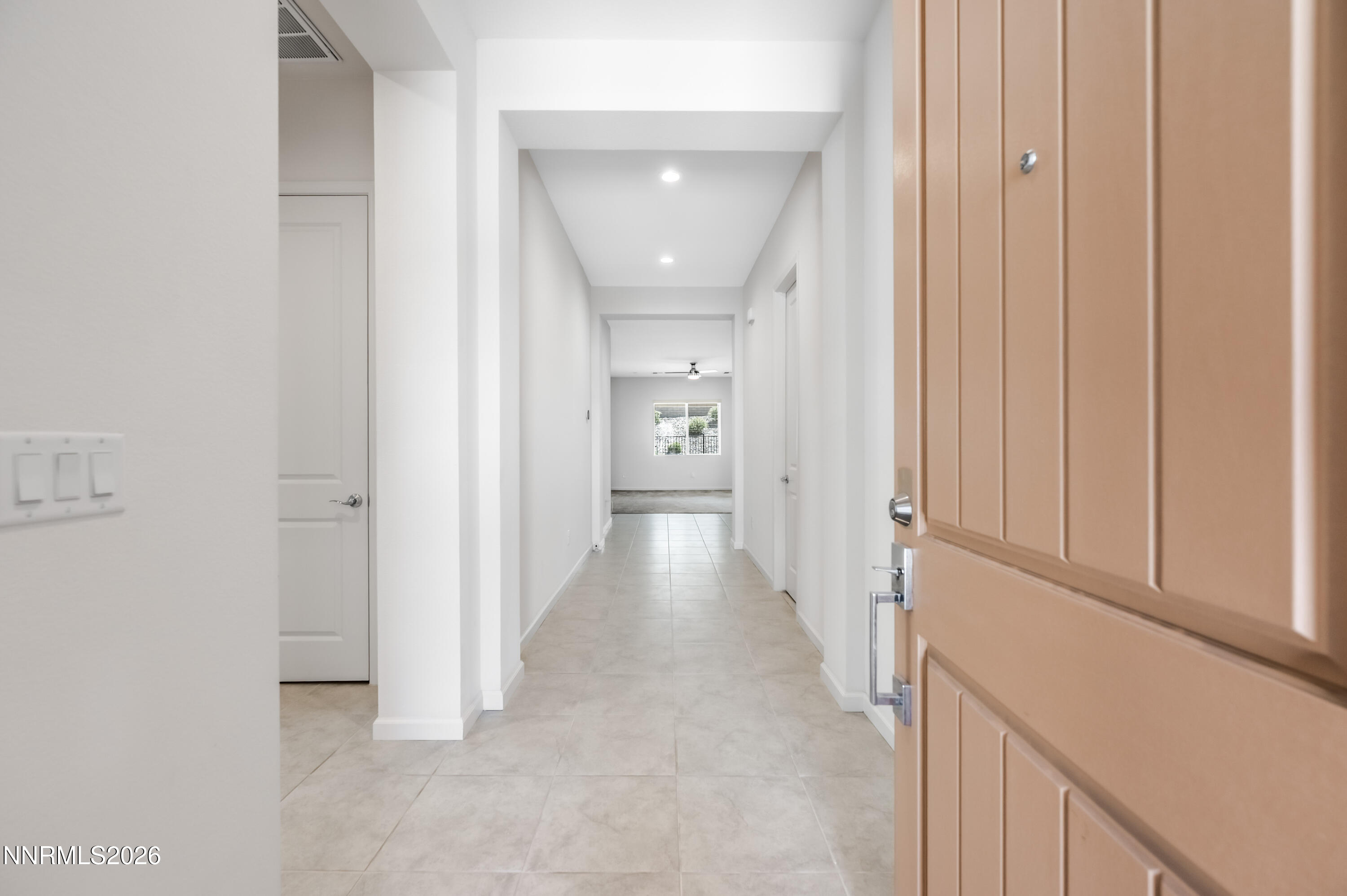 15024 Emerald Sunset Lane Reno, NV 89521 - Photo 15 of 73 a view of a hallway with wooden floor and staircase