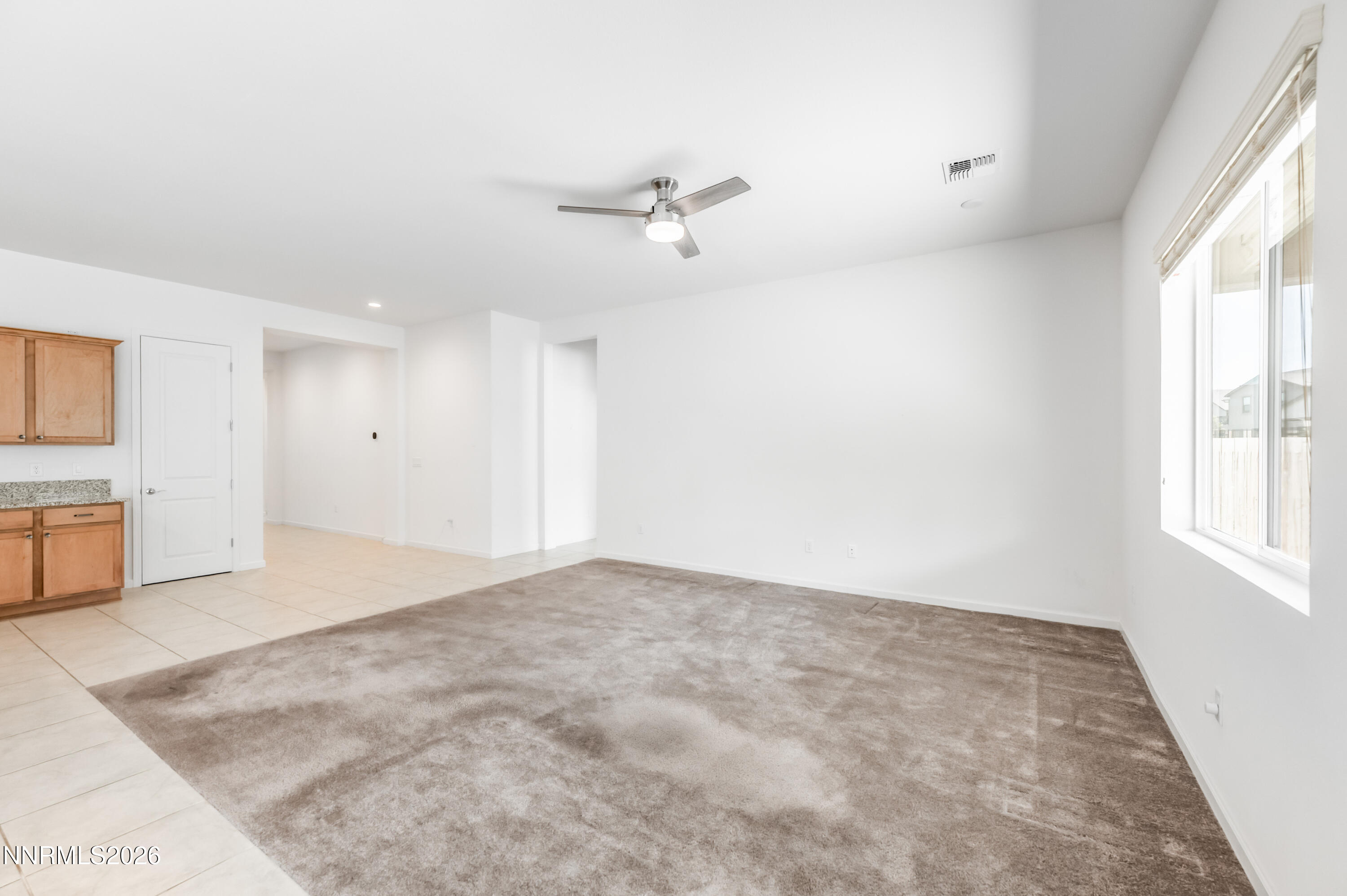 15024 Emerald Sunset Lane Reno, NV 89521 - Photo 20 of 73 an empty room with windows