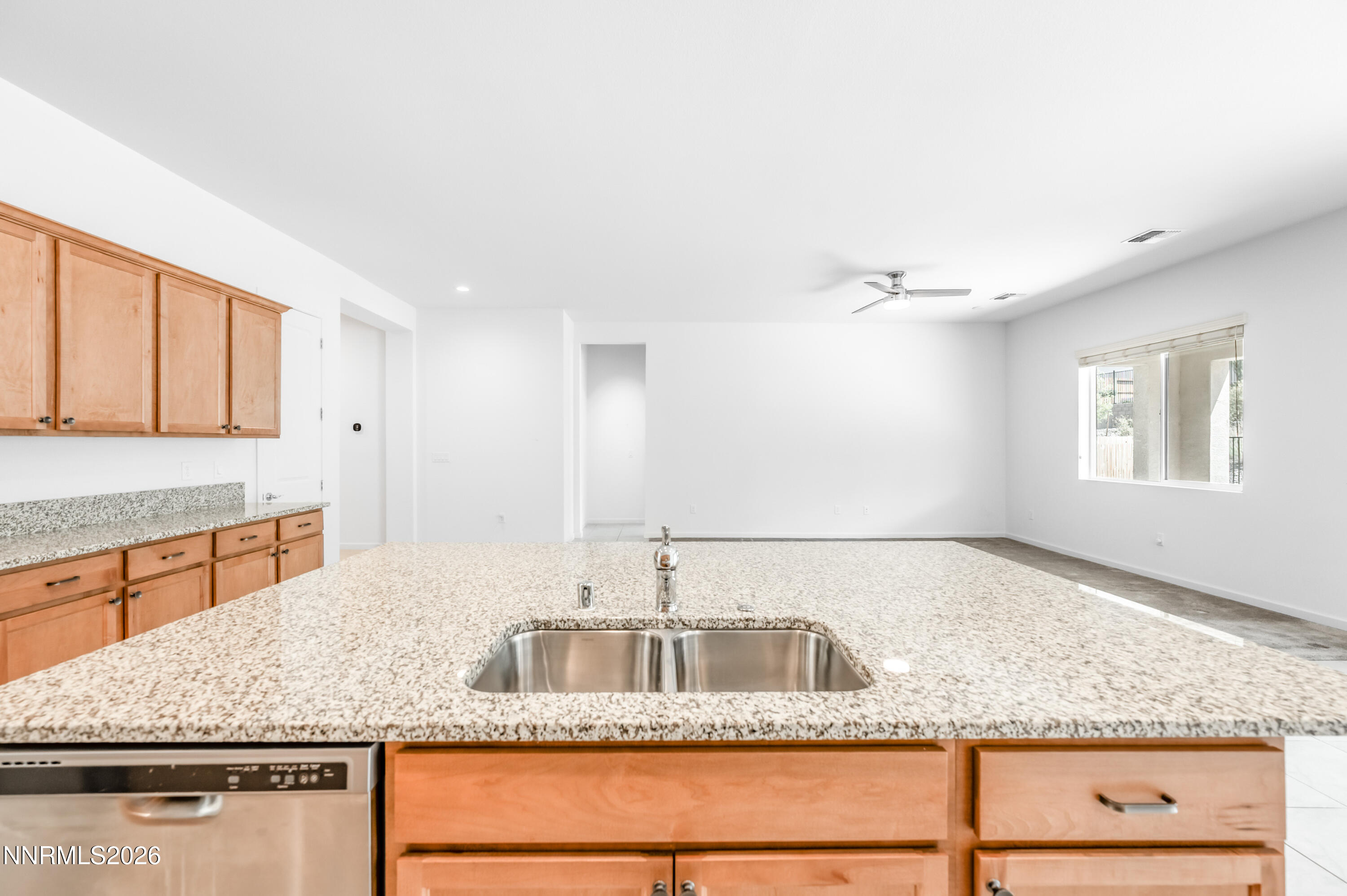 15024 Emerald Sunset Lane Reno, NV 89521 - Photo 30 of 73 a kitchen with stainless steel appliances granite countertop a sink and a granite counter tops