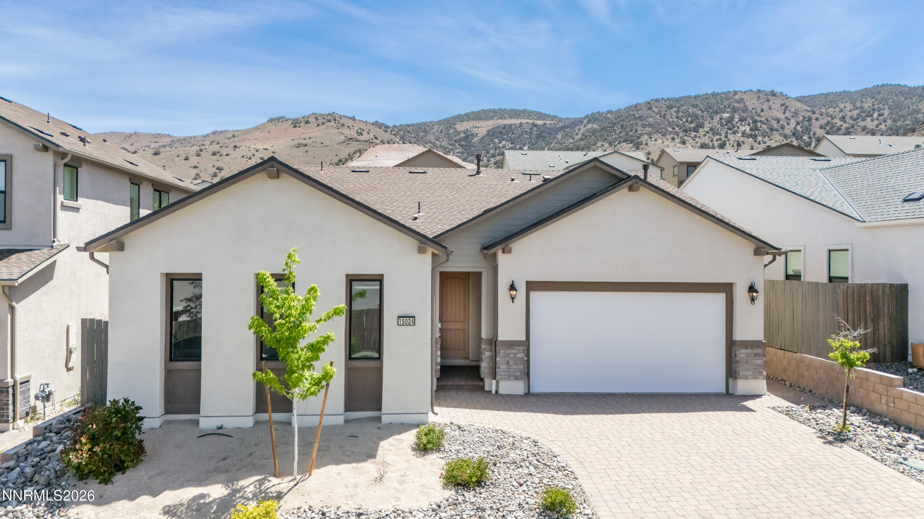 15024 Emerald Sunset Lane Reno, NV 89521 - Photo 3 of 73 a front view of a house with a yard
