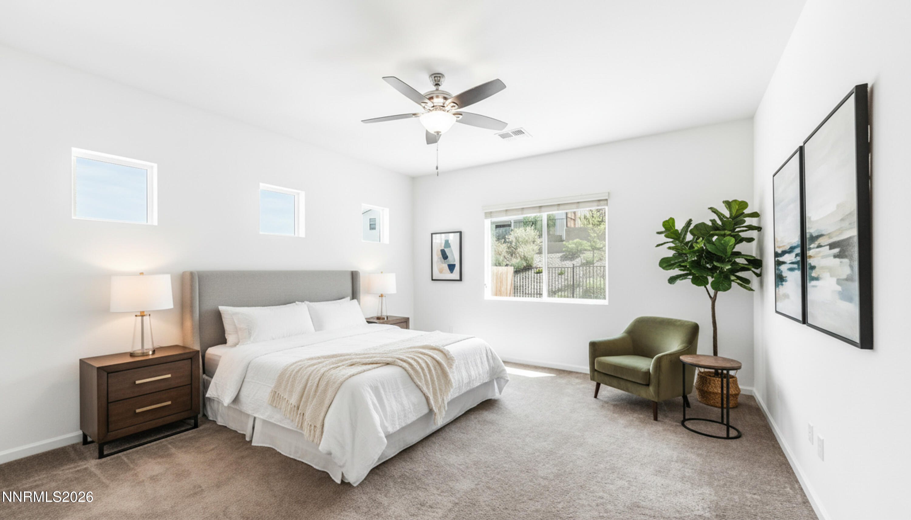 15024 Emerald Sunset Lane Reno, NV 89521 - Photo 32 of 73 a bedroom with a bed and a chandelier