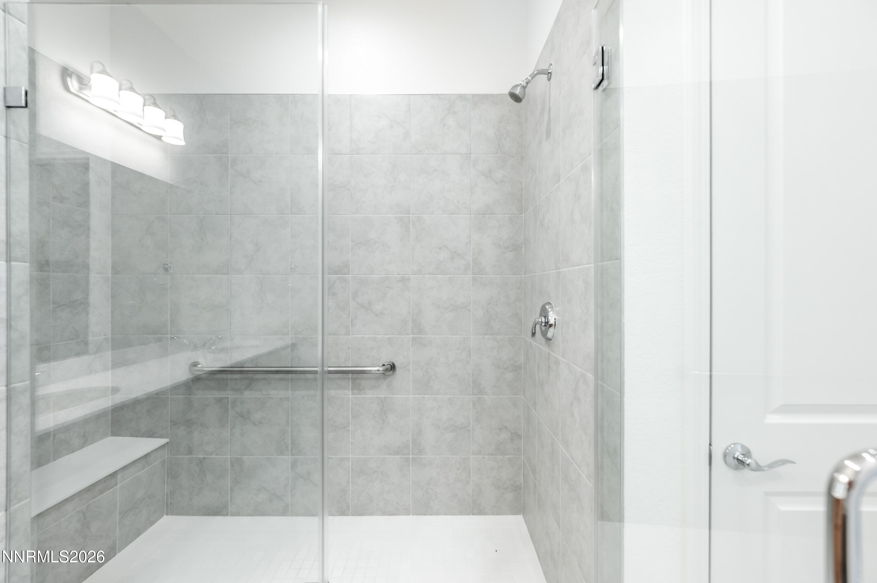 15024 Emerald Sunset Lane Reno, NV 89521 - Photo 38 of 73 a bathroom with a shower and a glass door