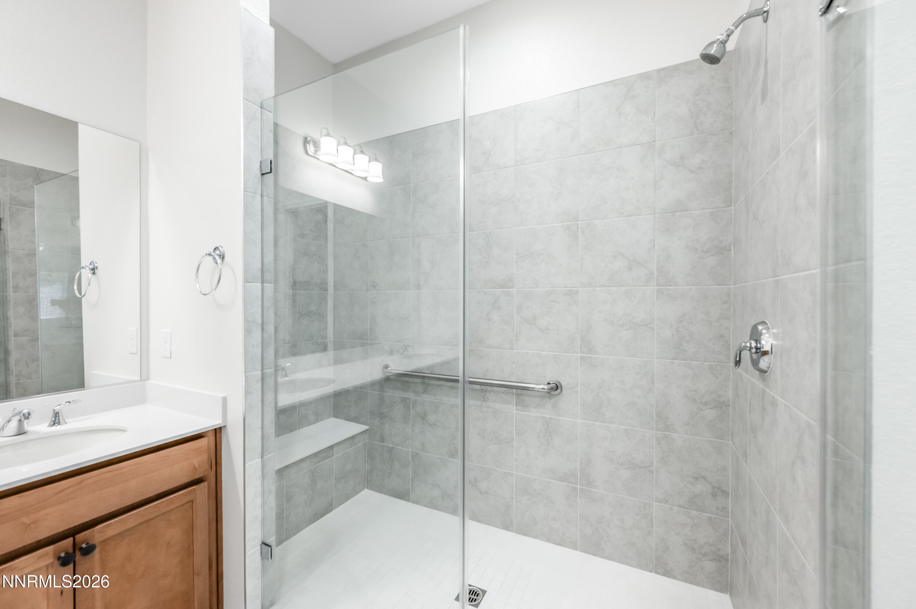 15024 Emerald Sunset Lane Reno, NV 89521 - Photo 39 of 73 a bathroom with a shower and a sink