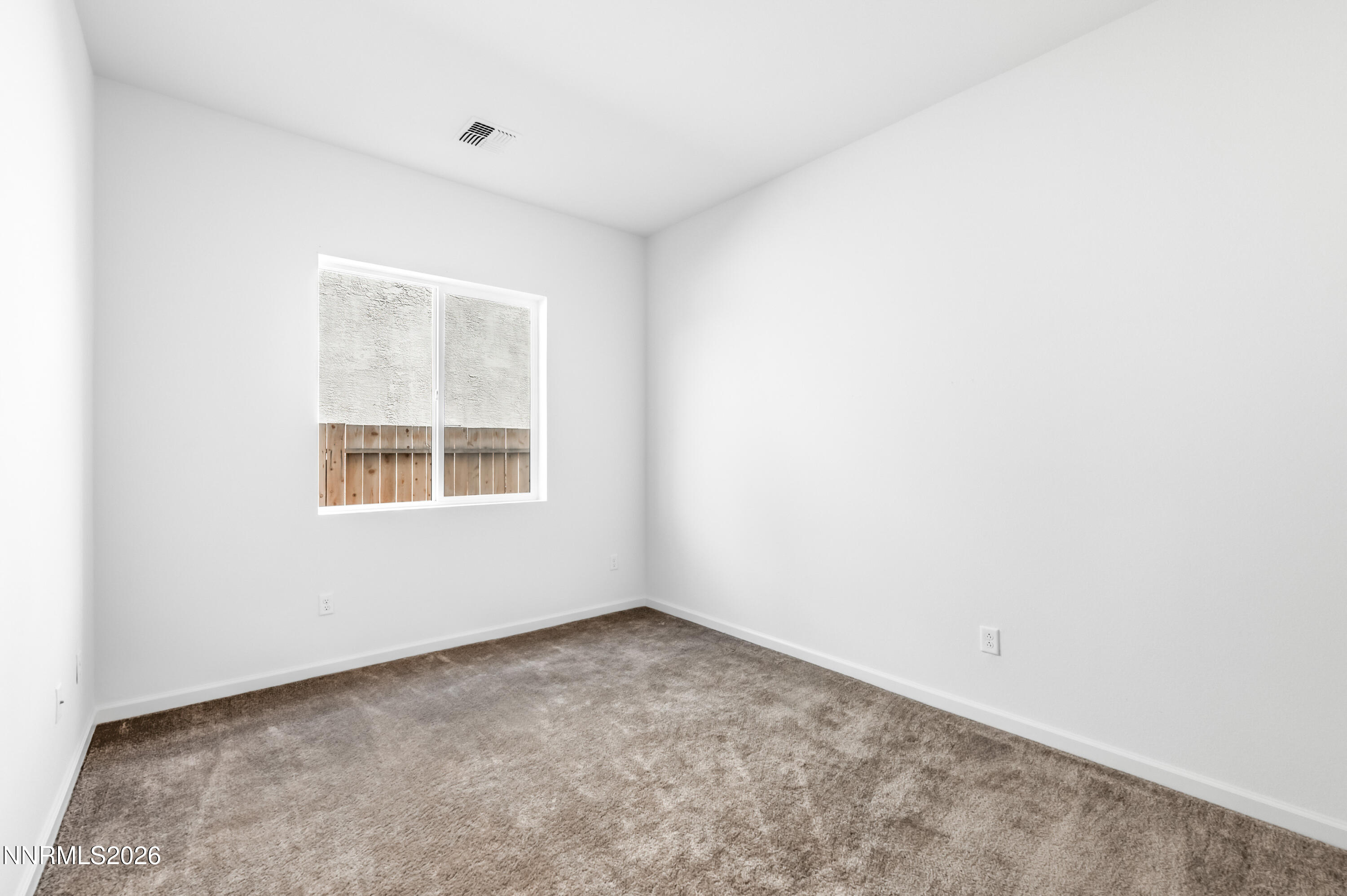 15024 Emerald Sunset Lane Reno, NV 89521 - Photo 43 of 73 an empty room with a window