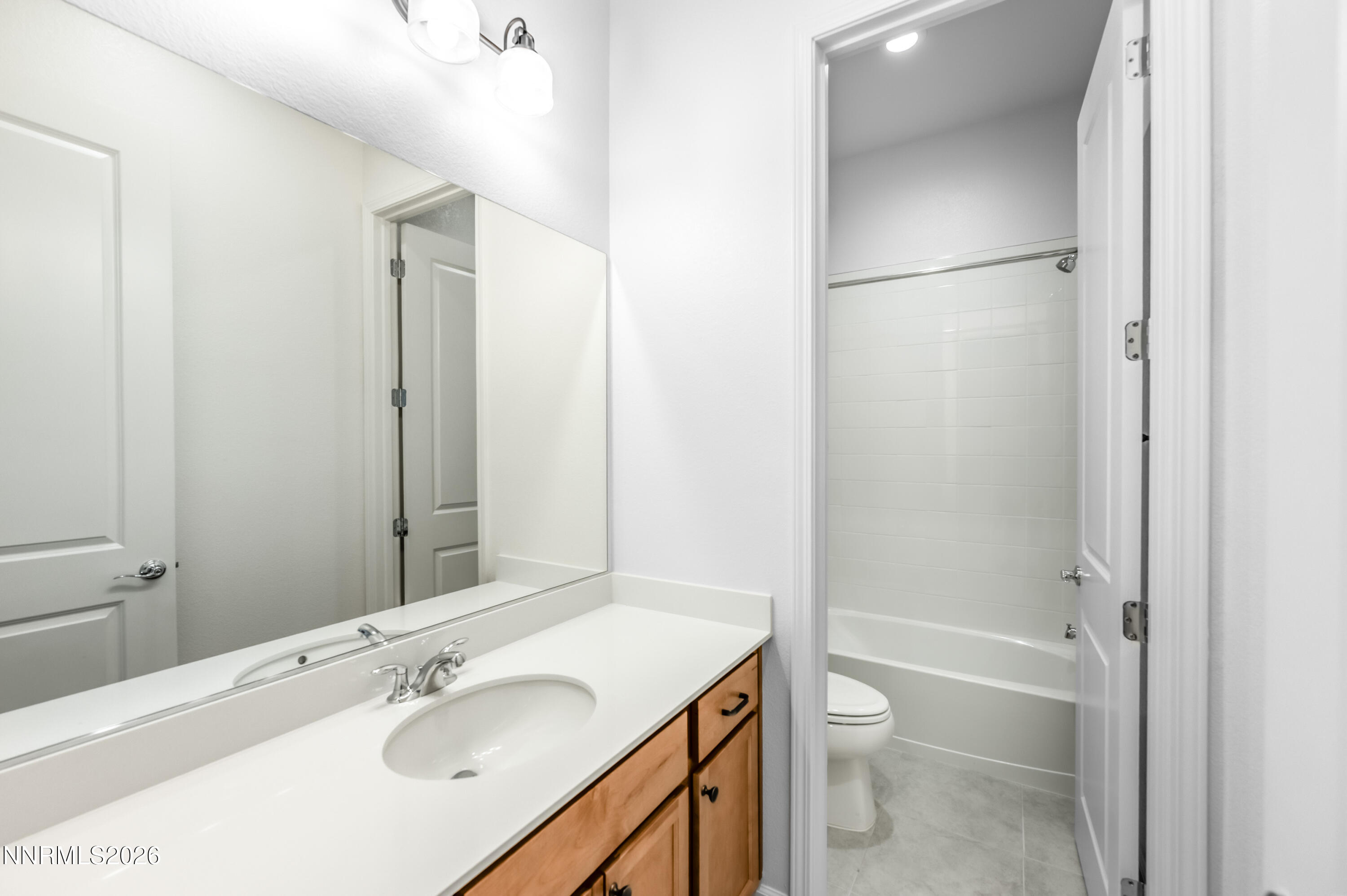 15024 Emerald Sunset Lane Reno, NV 89521 - Photo 45 of 73 a bathroom with a sink toilet and shower