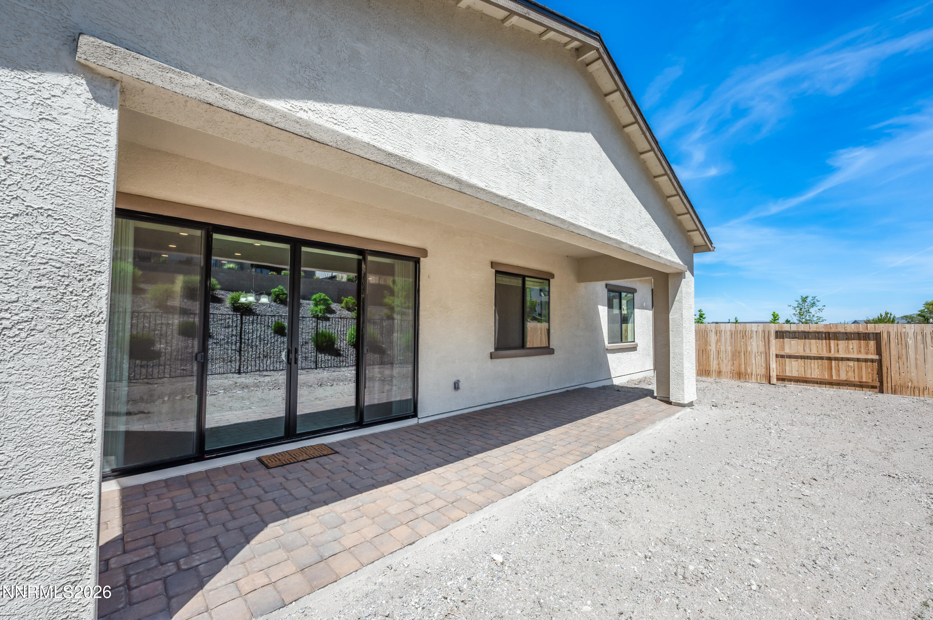 15024 Emerald Sunset Lane Reno, NV 89521 - Photo 51 of 73 a view of a house with a balcony and floor to ceiling window