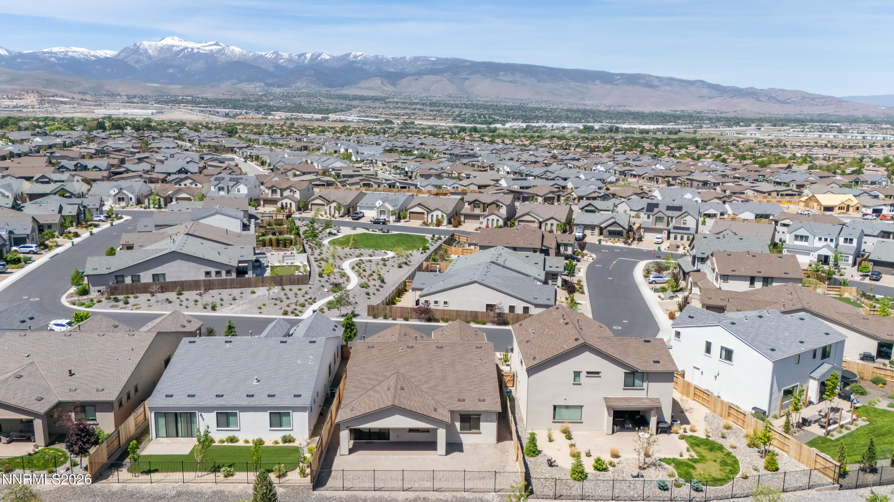 15024 Emerald Sunset Lane Reno, NV 89521 - Photo 60 of 73 an aerial view of residential houses with outdoor space and mountain view