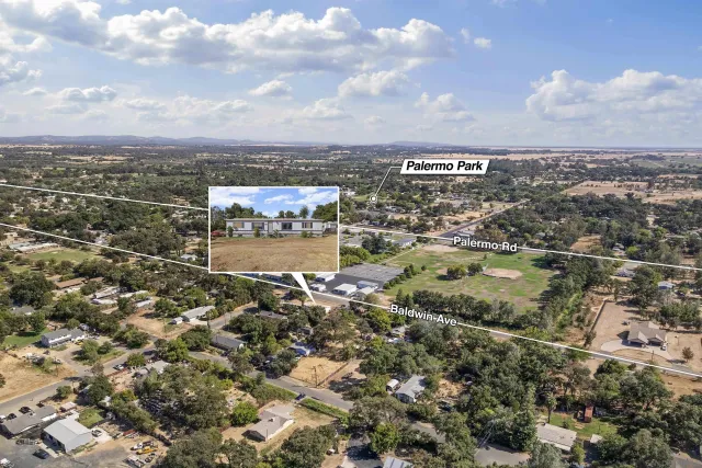 an aerial view of city and lake