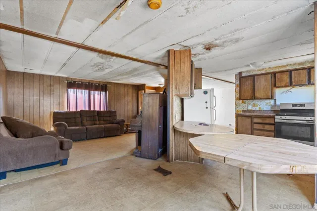 a kitchen with a sink appliances and cabinets