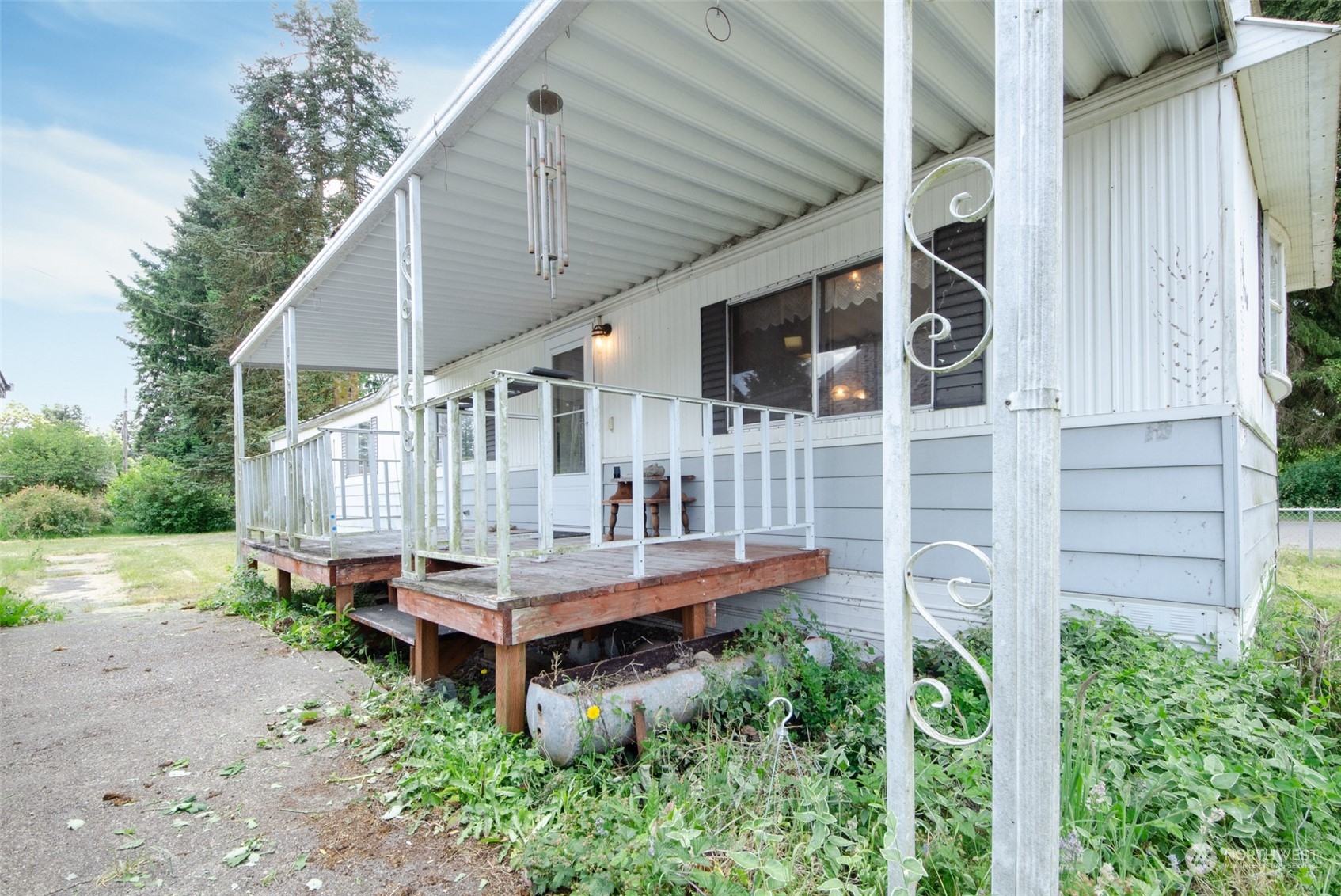 10319 184th Avenue Southwest Rochester, WA 98579 - Photo 12 of 14 a view of a house with a yard and deck