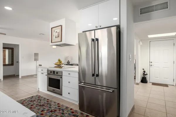 a bedroom with a bed and cabinets