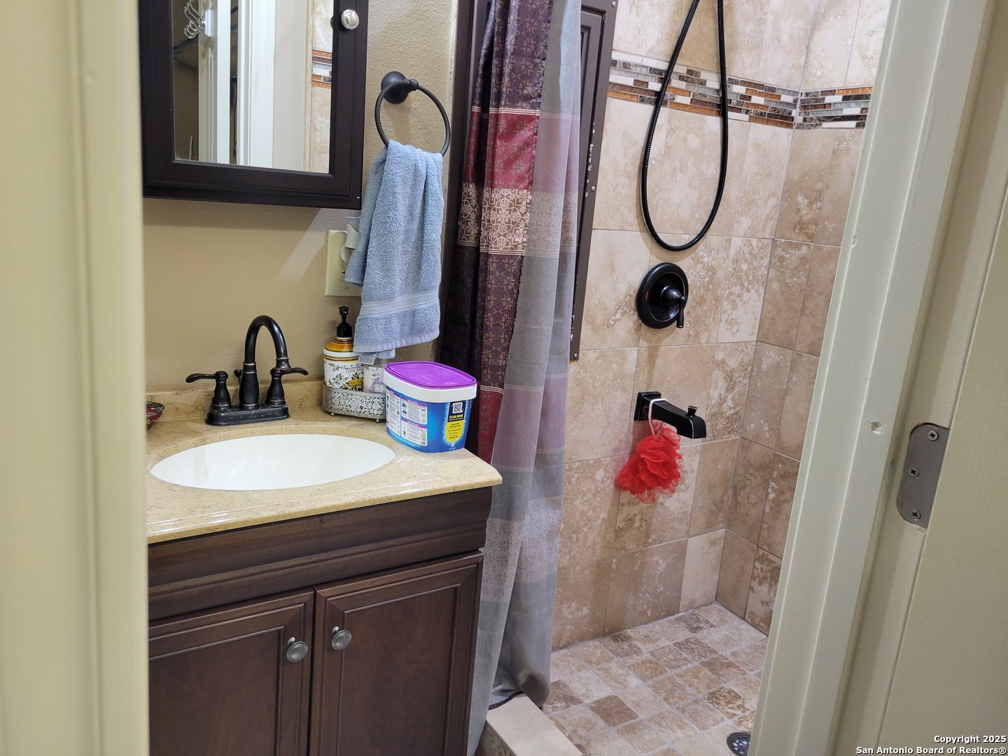1722 Palmer San Antonio, TX 78260 - Photo 28 of 35 a bathroom with a sink vanity and shower