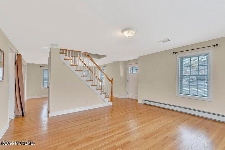 164 Jackson Street Matawan, NJ 07747 - Photo 11 of 27 a view of an empty room with wooden floor and a window