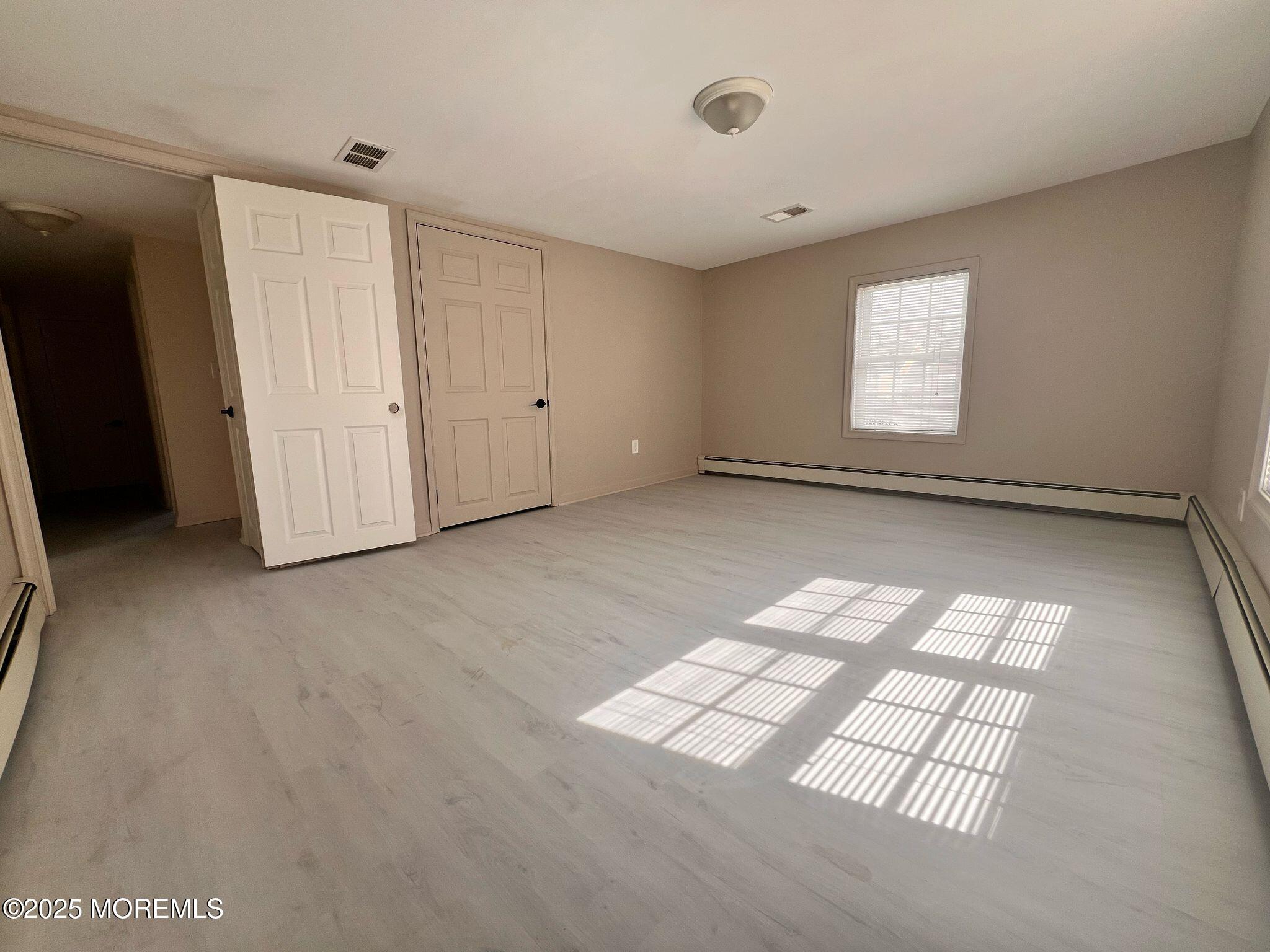 164 Jackson Street Matawan, NJ 07747 - Photo 17 of 27 an empty room with windows