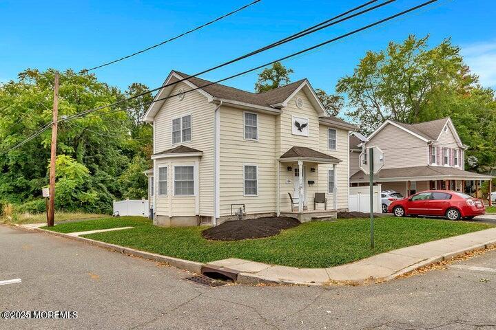 164 Jackson Street Matawan, NJ 07747 - Photo 2 of 27 a front view of a house with a yard and garage
