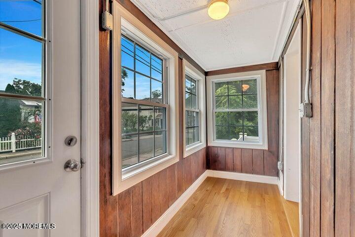 164 Jackson Street Matawan, NJ 07747 - Photo 23 of 27 a view of an empty room with wooden floor and a window