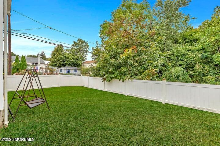 164 Jackson Street Matawan, NJ 07747 - Photo 24 of 27 a view of backyard with a table and chairs