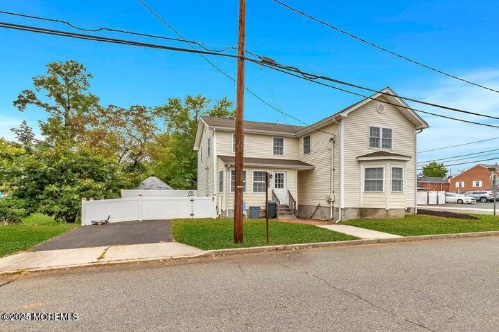 164 Jackson Street Matawan, NJ 07747 - Photo 3 of 27 a front view of a house with a garden and yard