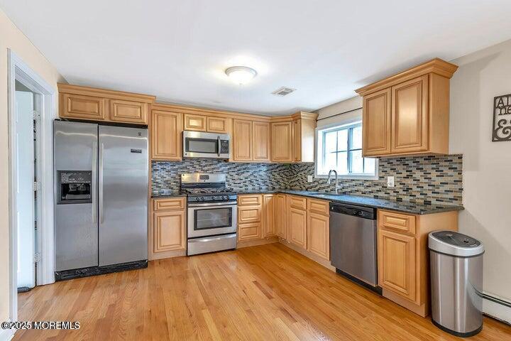 164 Jackson Street Matawan, NJ 07747 - Photo 6 of 27 a kitchen with stainless steel appliances granite countertop a stove a refrigerator and a sink