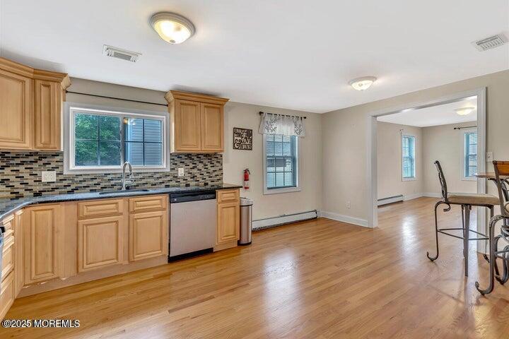 164 Jackson Street Matawan, NJ 07747 - Photo 7 of 27 a kitchen with granite countertop a stove a sink and a refrigerator
