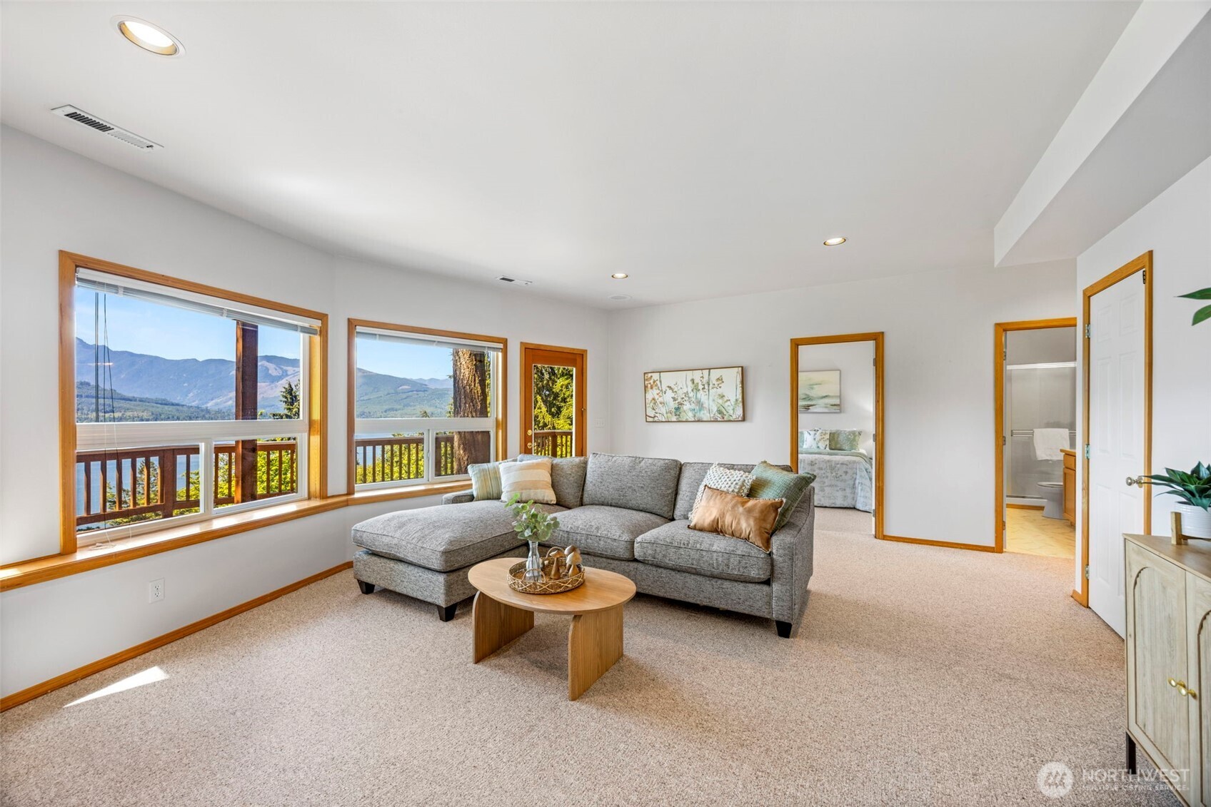 19736 Northwest Stavis Bay Road Seabeck, WA 98380 - Photo 27 of 39 a living room with furniture and a large window