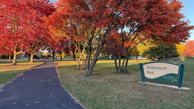 a sign board with a park benches