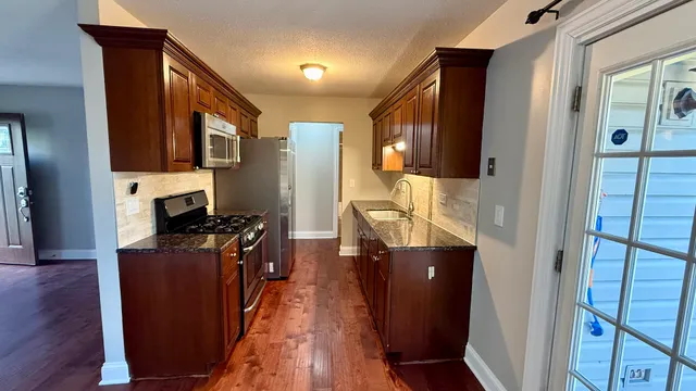 a view of living room with wooden floor