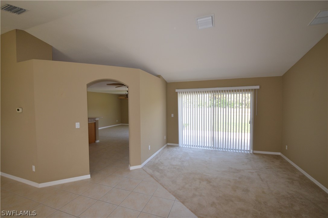 142 Ridgemont Drive Lehigh Acres, FL 33972 - Photo 2 of 15 a view of a livingroom with a staircase