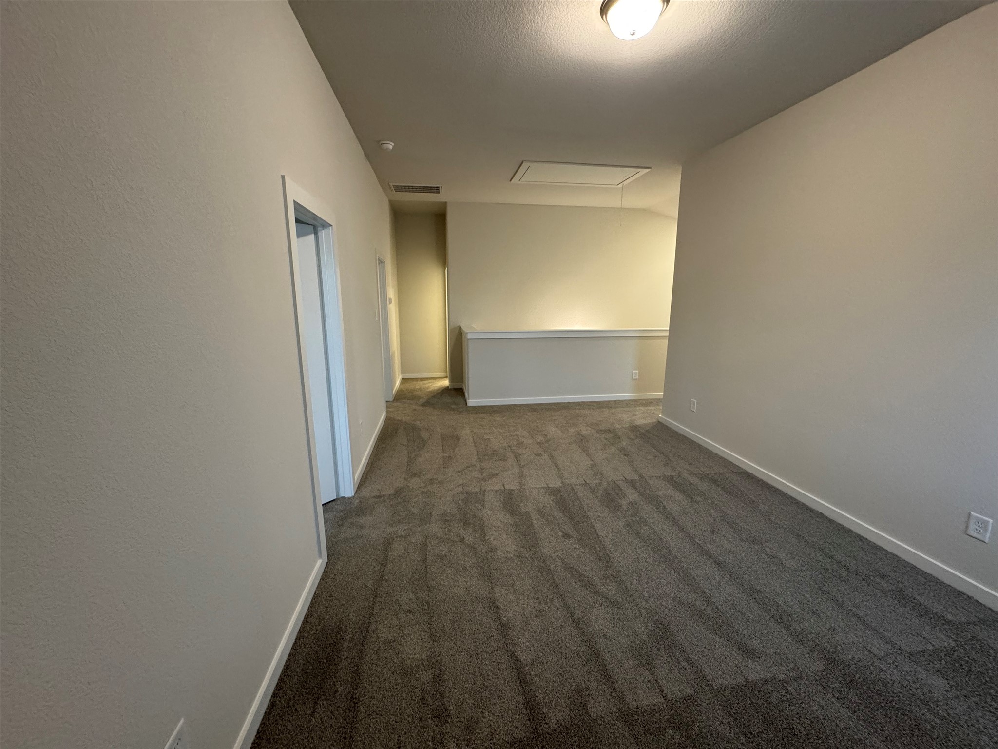 18731 Frost Ridge Drive Crosby, TX 77532 - Photo 22 of 26 a view of a room with wooden floor staircase and a hallway