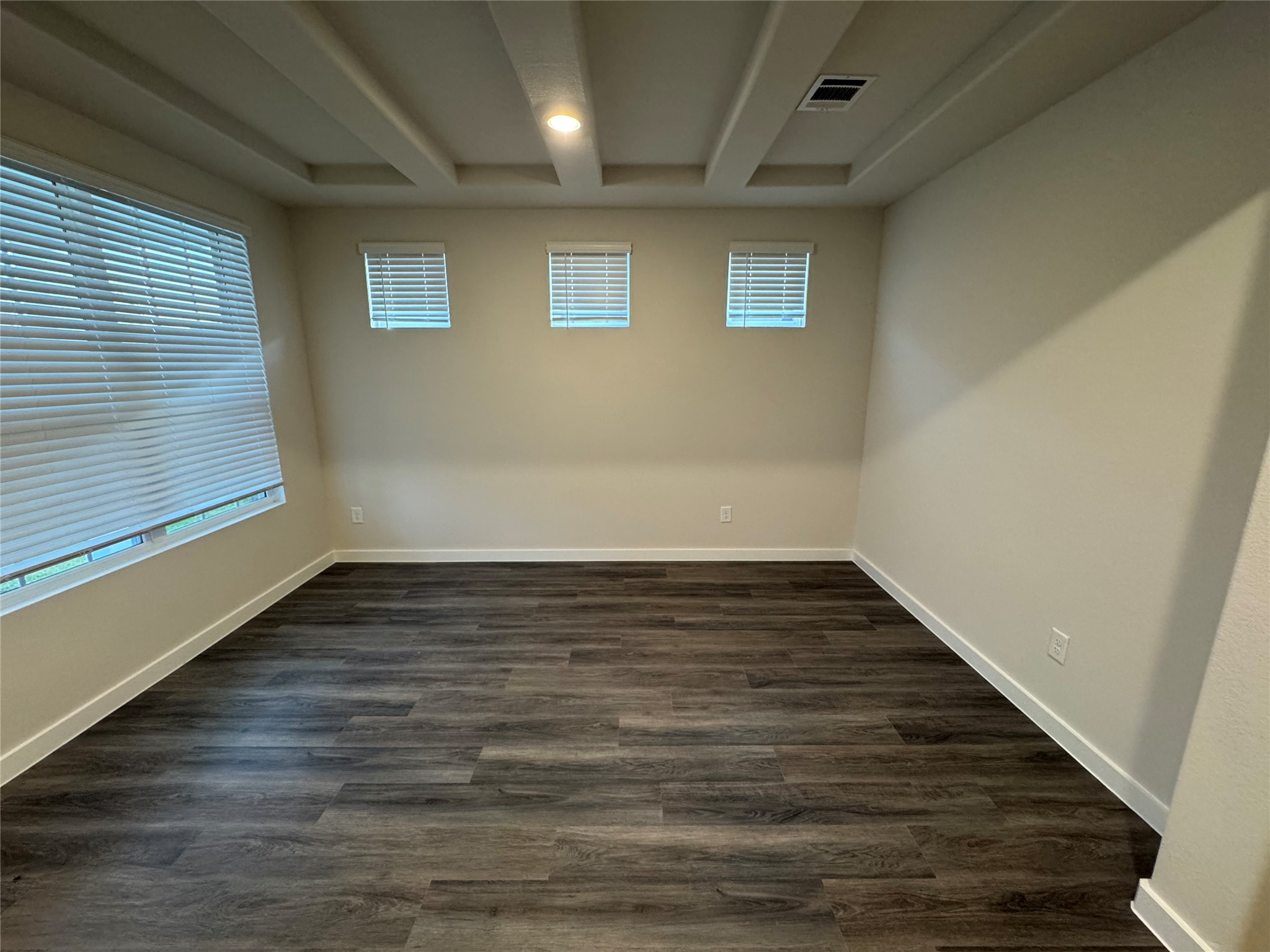 18731 Frost Ridge Drive Crosby, TX 77532 - Photo 3 of 26 a view of an empty room with wooden floor and a window