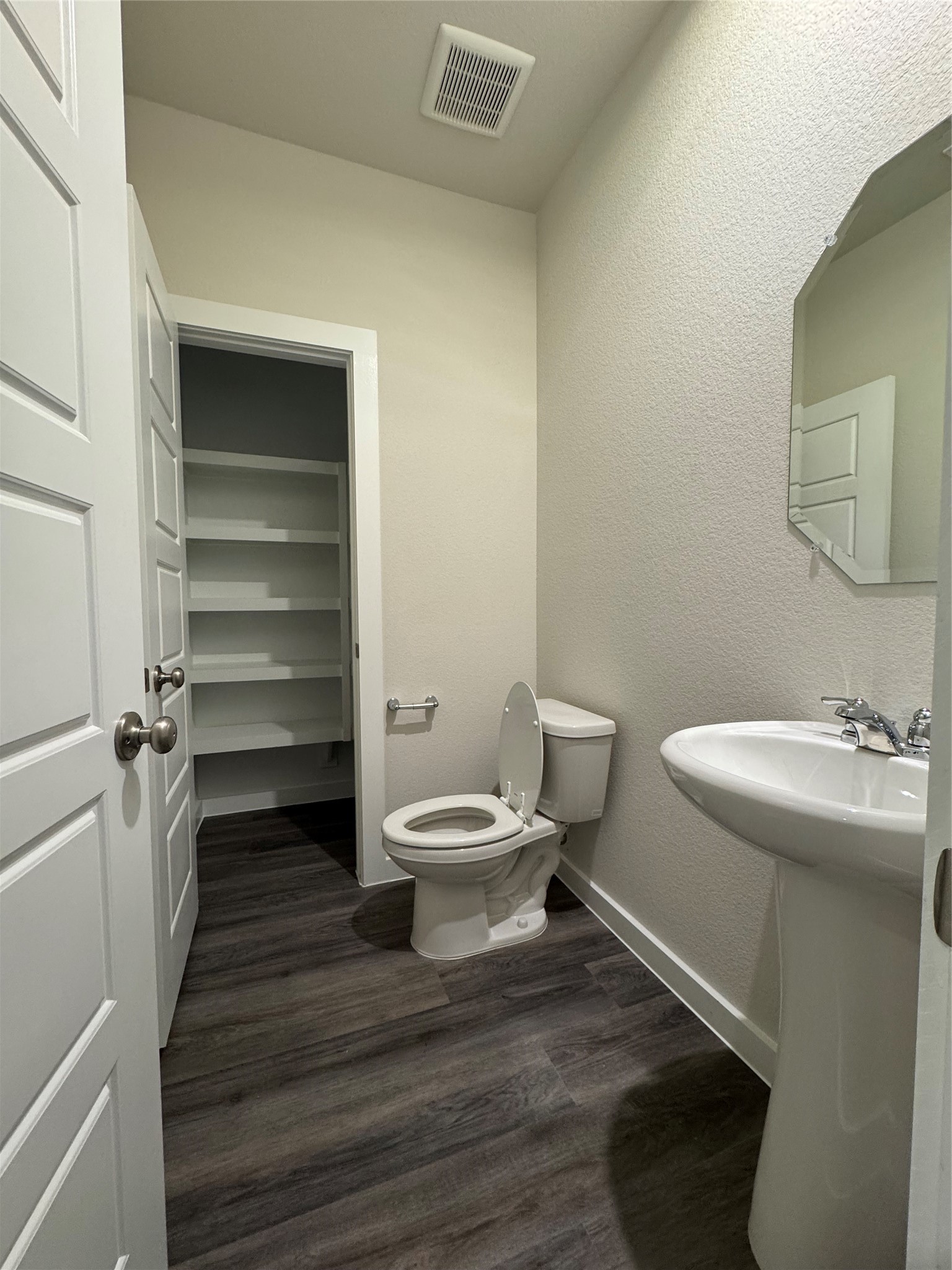 18731 Frost Ridge Drive Crosby, TX 77532 - Photo 4 of 26 a bathroom with a toilet and a sink