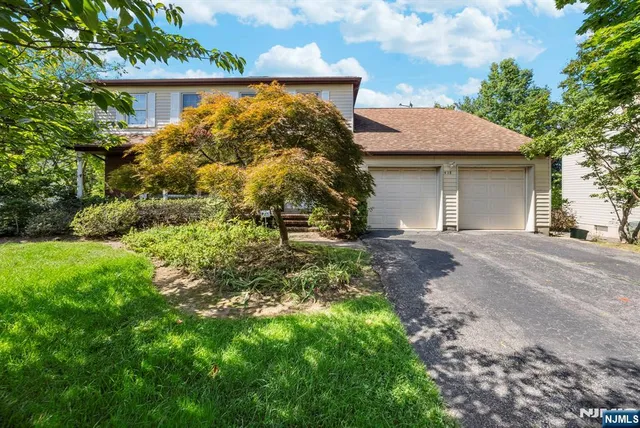 a view of a house with a tree