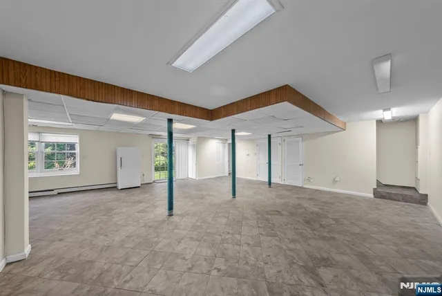 a view of empty room with floor to ceiling window