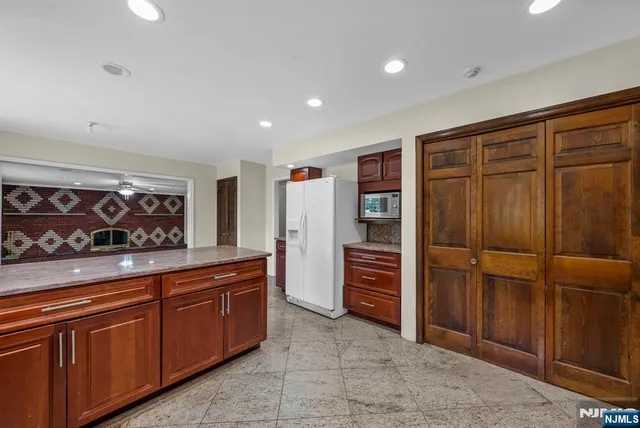 a view of a kitchen with furniture and cabinet