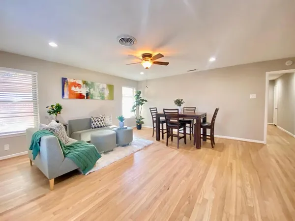 a living room with furniture and white walls
