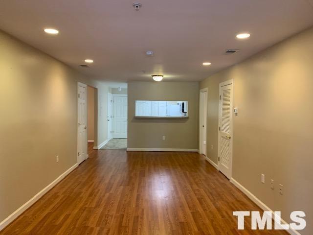 929 Morreene Road, Unit C21 Durham, NC 27705 - Photo 5 of 9 a view of hallway with wooden floor