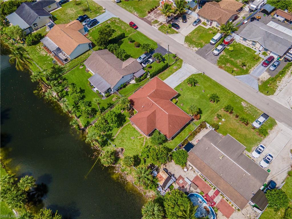 2100 55th Street Southwest Naples, FL 34116 - Photo 15 of 50 an aerial view of a house with a garden