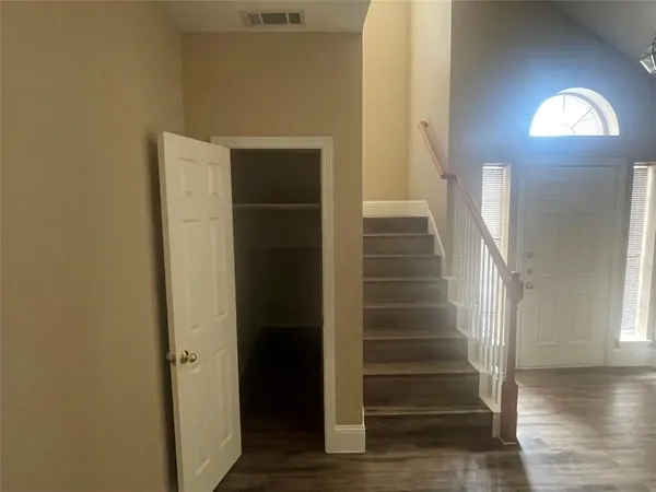 a view of entryway with wooden floor