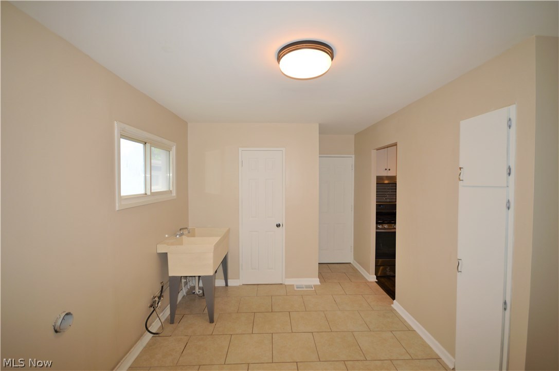 6468 Sherborn Road Parma Heights, OH 44130 - Photo 7 of 26 Spacious laundry room/mud room coming in from the garage!