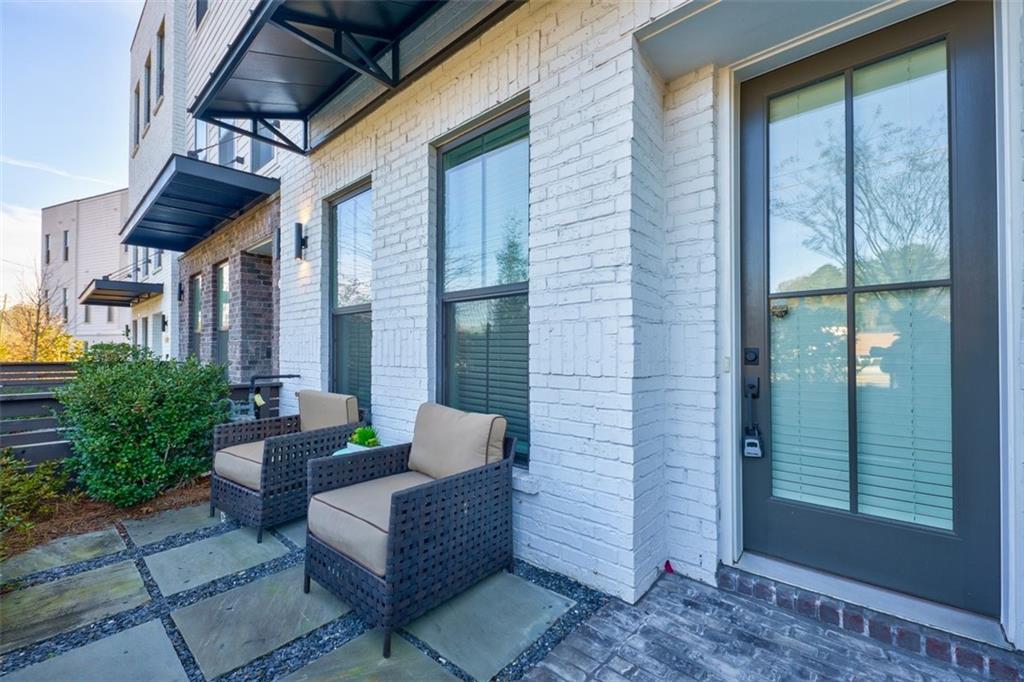 858 Constellation Drive Decatur, GA 30033 - Photo 1 of 1 a view of a patio with couches table and chairs and potted plants
